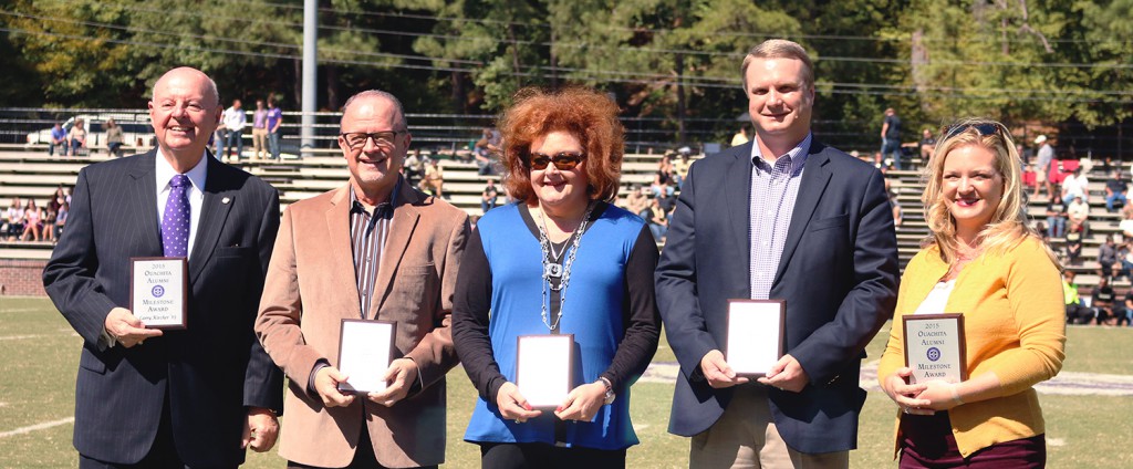 Ouachita’s 2015 Alumni Milestone Award recipients included (left to right): Larry Kircher, Larry Grayson, Mary Pat Anthony, Andrew Clark and Jessica Bubbus. They received their awards during halftime at Ouachita's homecoming football game against Harding University. Photo by Grace Finley.