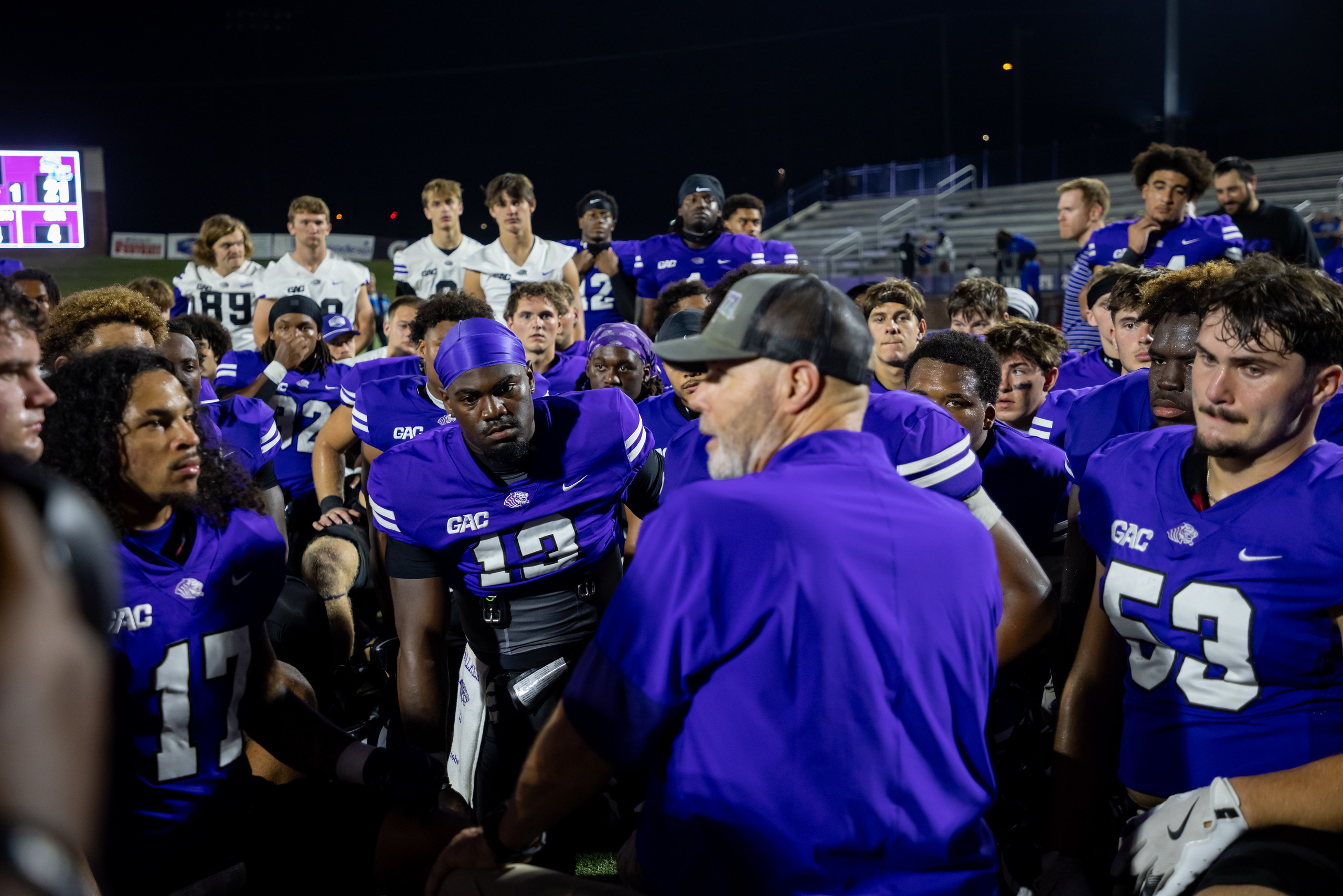 Coach Knight takes intentional time with his players after the game | Photo by Joshua Rhine