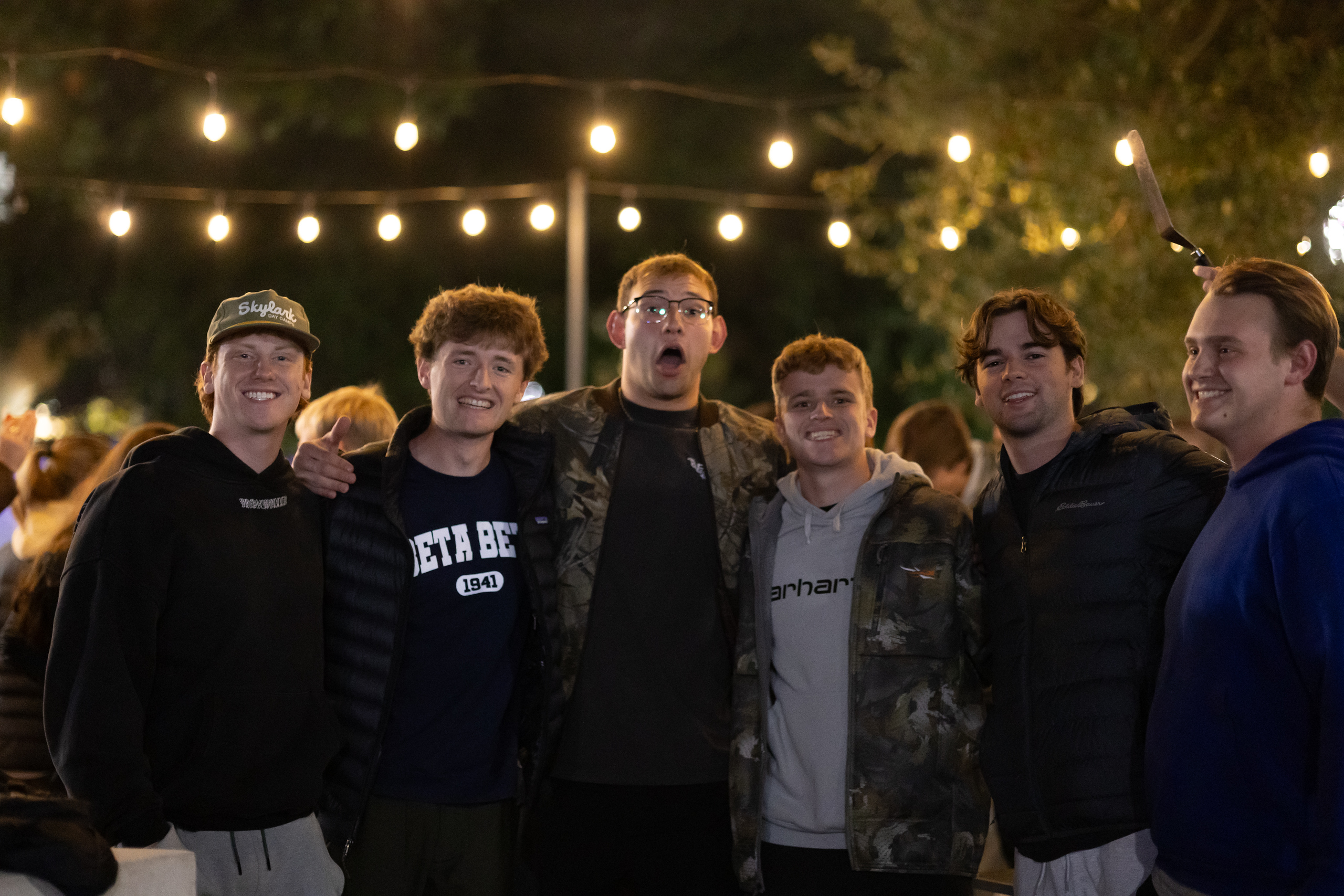 Group of guys enjoying guarding the tiger together | Photo by Matthew Correll