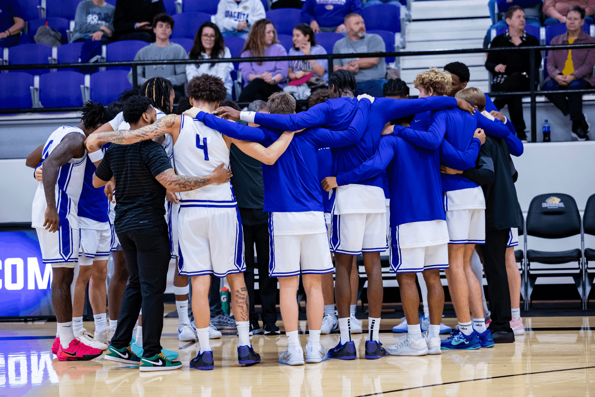 The team huddled up to hear the game plan from coach | Photo by Joshua Rhine