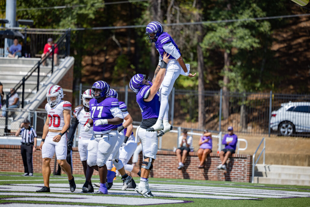 The tigers celebrate their Homecoming win | Photo by Joshua Rhine