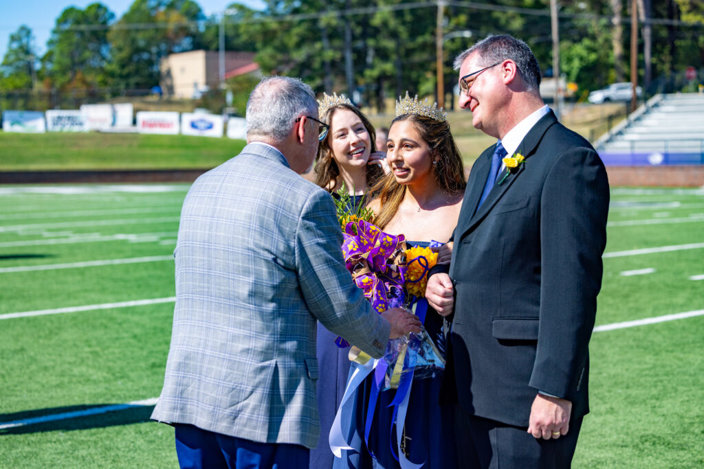 Silvi Cardona crowned Homecoming Queen by previous queen, Hannah Goodrum | Photo by Joshua Rhine